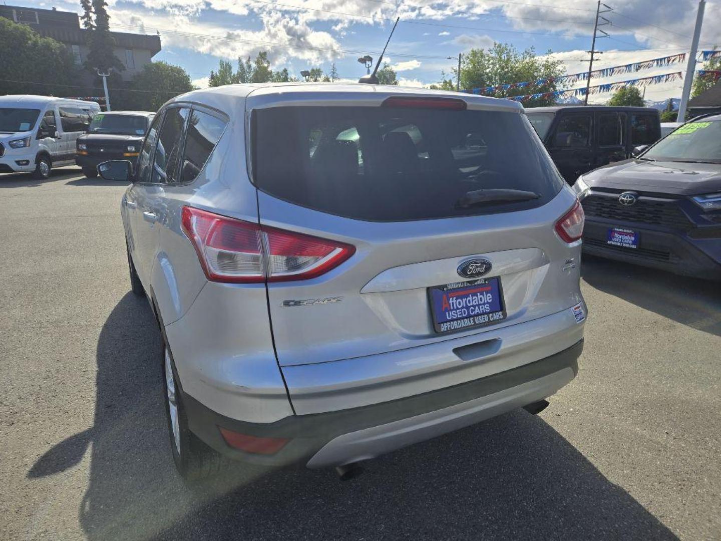 2015 SILVER FORD ESCAPE SE (1FMCU9GX5FU) with an 1.6L engine, Automatic transmission, located at 929 East 8th Ave, Anchorage, AK, 99501, (907) 274-2277, 61.214783, -149.866074 - Photo#2