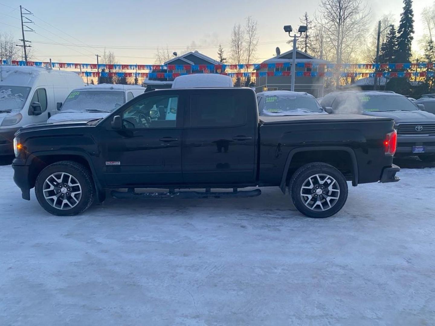 2017 BLACK GMC SIERRA 1500 SLT (3GTU2NEC3HG) with an 5.3L engine, Automatic transmission, located at 929 East 8th Ave, Anchorage, AK, 99501, (907) 274-2277, 61.214783, -149.866074 - Photo#1