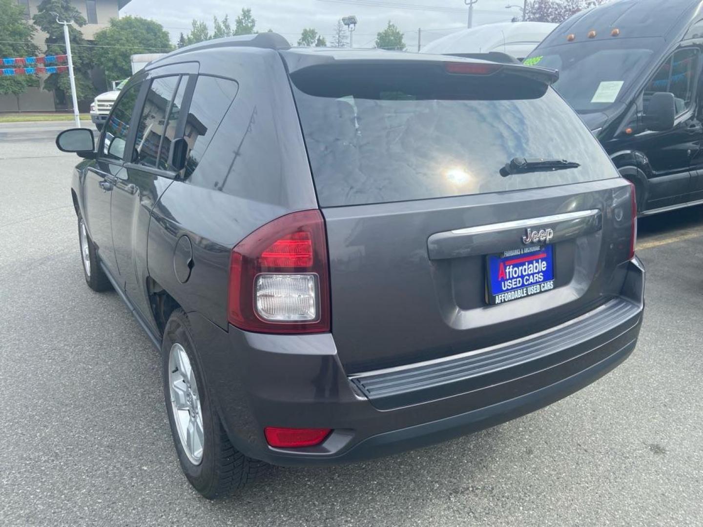 2015 BLACK JEEP COMPASS SPORT (1C4NJCBA6FD) with an 2.0L engine, Continuously Variable transmission, located at 929 East 8th Ave, Anchorage, AK, 99501, (907) 274-2277, 61.214783, -149.866074 - Photo#2