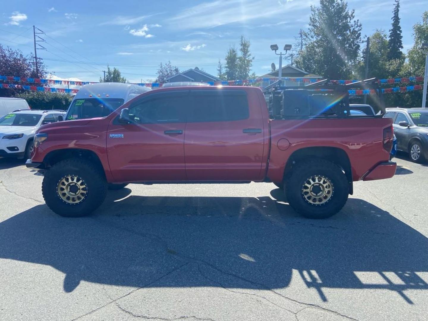 2014 RED TOYOTA TUNDRA CREWMAX PLATINUM (5TFAY5F10EX) with an 5.7L engine, Automatic transmission, located at 929 East 8th Ave, Anchorage, AK, 99501, (907) 274-2277, 61.214783, -149.866074 - Photo#1