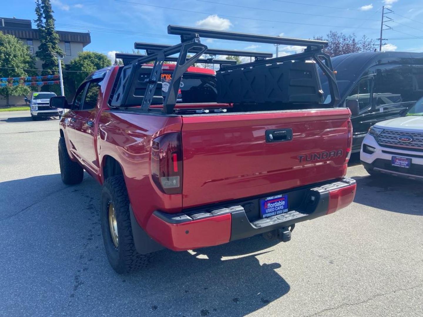 2014 RED TOYOTA TUNDRA CREWMAX PLATINUM (5TFAY5F10EX) with an 5.7L engine, Automatic transmission, located at 929 East 8th Ave, Anchorage, AK, 99501, (907) 274-2277, 61.214783, -149.866074 - Photo#2