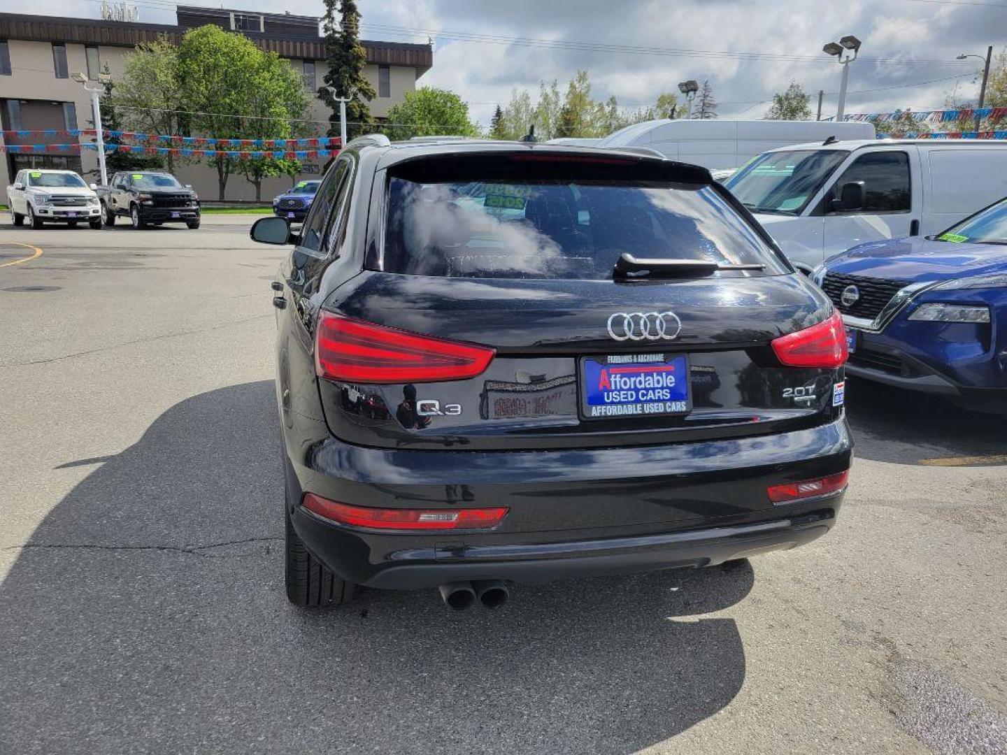 2015 BLACK AUDI Q3 PREMIUM PLUS (WA1EFCFS3FR) with an 2.0L engine, Automatic transmission, located at 929 East 8th Ave, Anchorage, AK, 99501, (907) 274-2277, 61.214783, -149.866074 - Photo#2