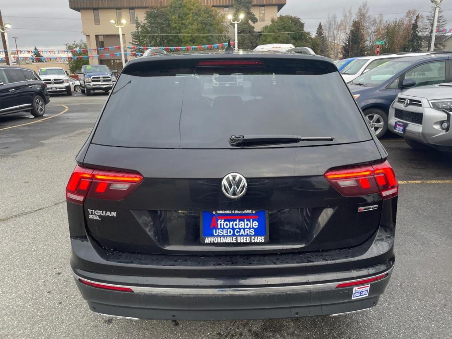 2021 BLACK VOLKSWAGEN TIGUAN SEL SE (3VV2B7AX4MM) with an 2.0L engine, Automatic transmission, located at 929 East 8th Ave, Anchorage, AK, 99501, (907) 274-2277, 61.214783, -149.866074 - Photo#2