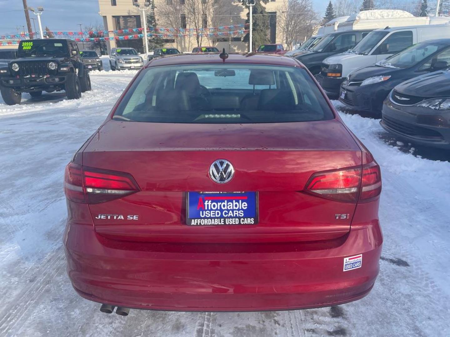 2017 RED VOLKSWAGEN JETTA SE (3VWB67AJ2HM) with an 1.4L engine, 5-Speed Manual transmission, located at 929 East 8th Ave, Anchorage, AK, 99501, (907) 274-2277, 61.214783, -149.866074 - Photo#2