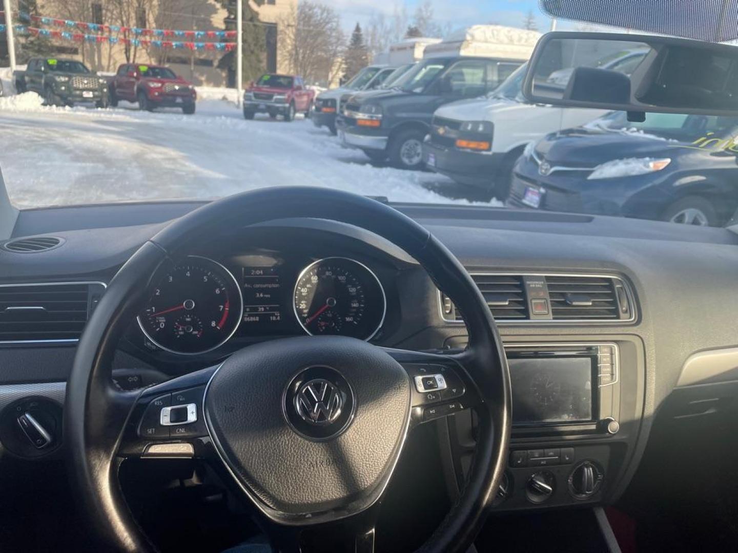 2017 RED VOLKSWAGEN JETTA SE (3VWB67AJ2HM) with an 1.4L engine, 5-Speed Manual transmission, located at 929 East 8th Ave, Anchorage, AK, 99501, (907) 274-2277, 61.214783, -149.866074 - Photo#4