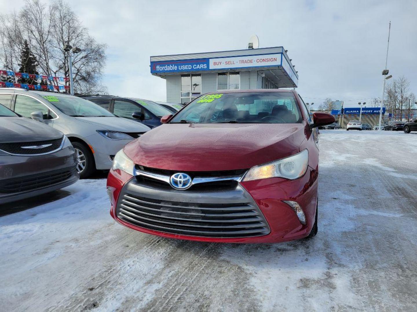 2016 RED TOYOTA CAMRY HYBRID (4T1BD1FK0GU) with an 2.5L engine, Continuously Variable transmission, located at 929 East 8th Ave, Anchorage, AK, 99501, (907) 274-2277, 61.214783, -149.866074 - Photo#0