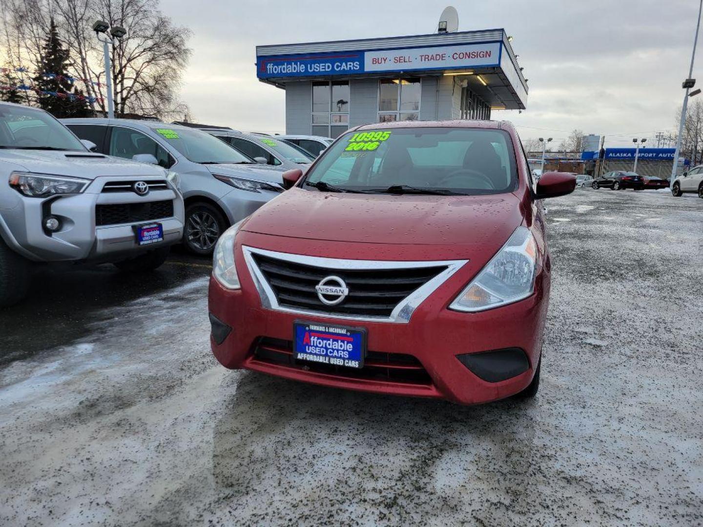 2016 RED NISSAN VERSA S (3N1CN7AP5GL) with an 1.6L engine, Continuously Variable transmission, located at 929 East 8th Ave, Anchorage, AK, 99501, (907) 274-2277, 61.214783, -149.866074 - Photo#0