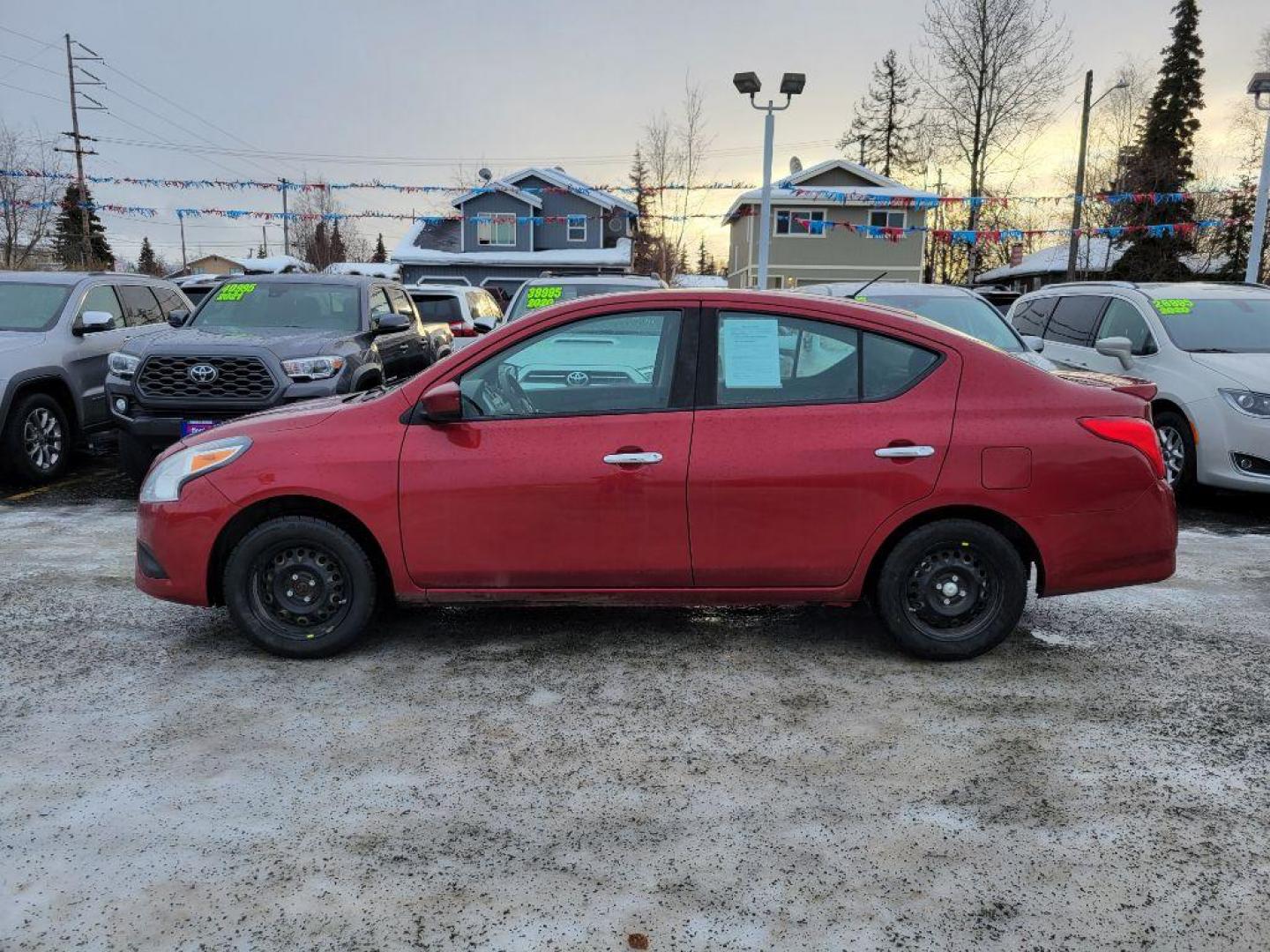 2016 RED NISSAN VERSA S (3N1CN7AP5GL) with an 1.6L engine, Continuously Variable transmission, located at 929 East 8th Ave, Anchorage, AK, 99501, (907) 274-2277, 61.214783, -149.866074 - Photo#1