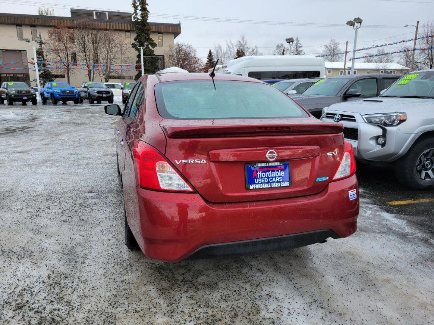 2016 RED NISSAN VERSA S (3N1CN7AP5GL) with an 1.6L engine, Continuously Variable transmission, located at 929 East 8th Ave, Anchorage, AK, 99501, (907) 274-2277, 61.214783, -149.866074 - Photo#2