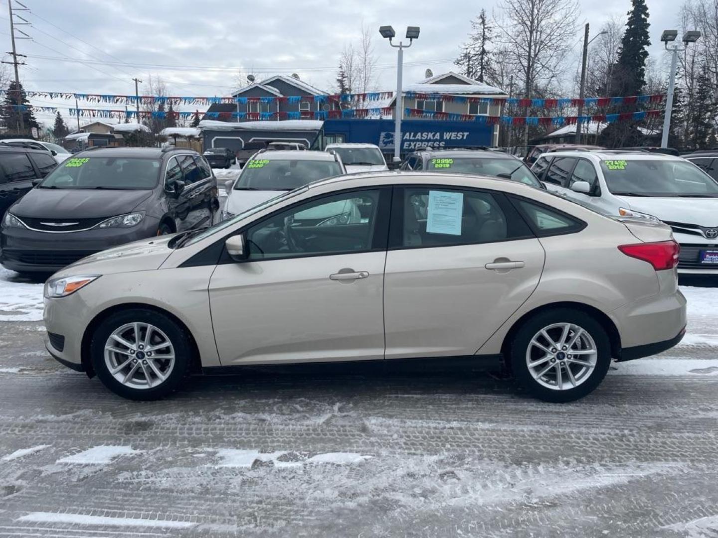 2017 TAN FORD FOCUS SE (1FADP3F25HL) with an 2.0L engine, Automatic transmission, located at 929 East 8th Ave, Anchorage, AK, 99501, (907) 274-2277, 61.214783, -149.866074 - Photo#1