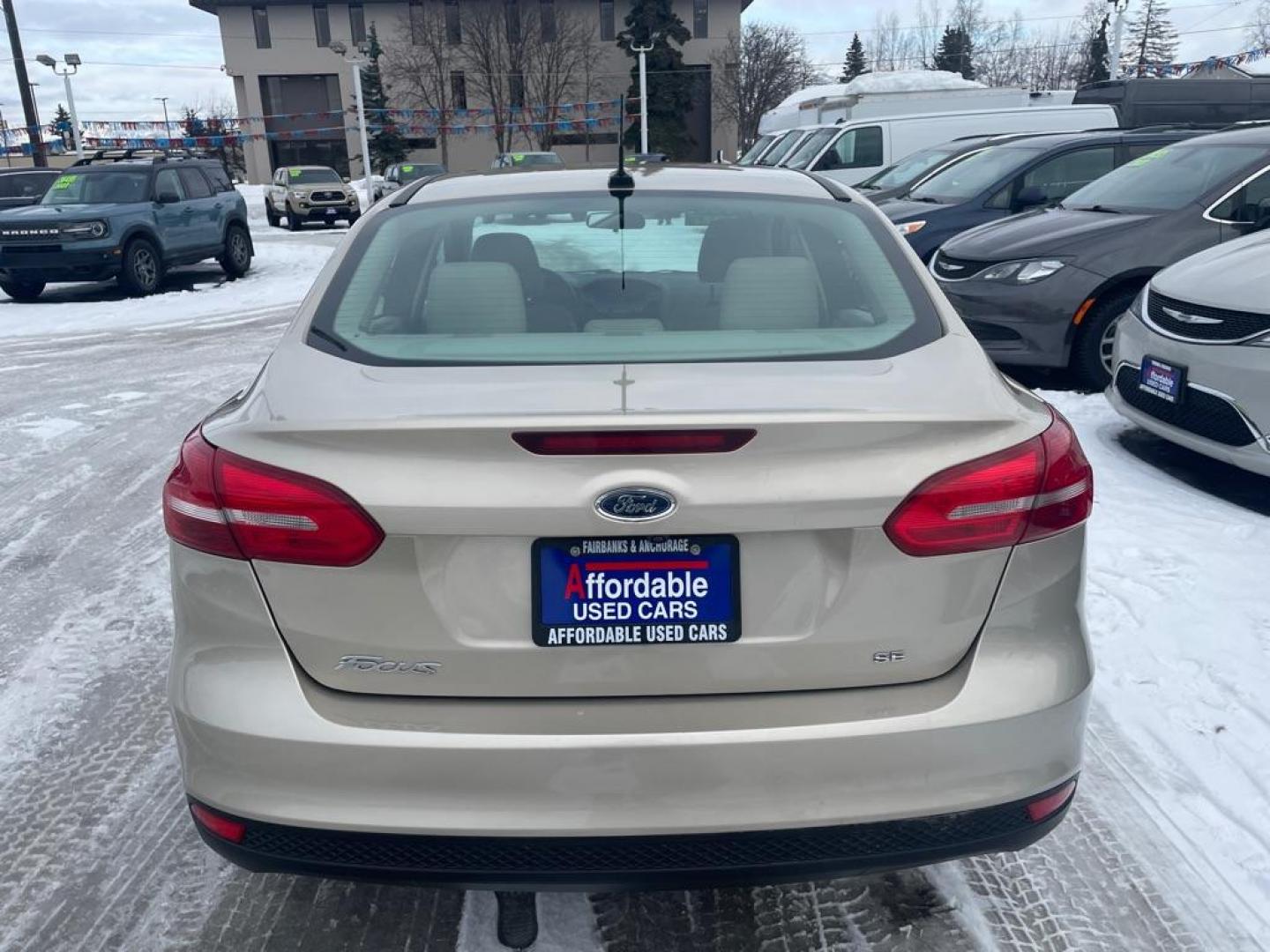 2017 TAN FORD FOCUS SE (1FADP3F25HL) with an 2.0L engine, Automatic transmission, located at 929 East 8th Ave, Anchorage, AK, 99501, (907) 274-2277, 61.214783, -149.866074 - Photo#2