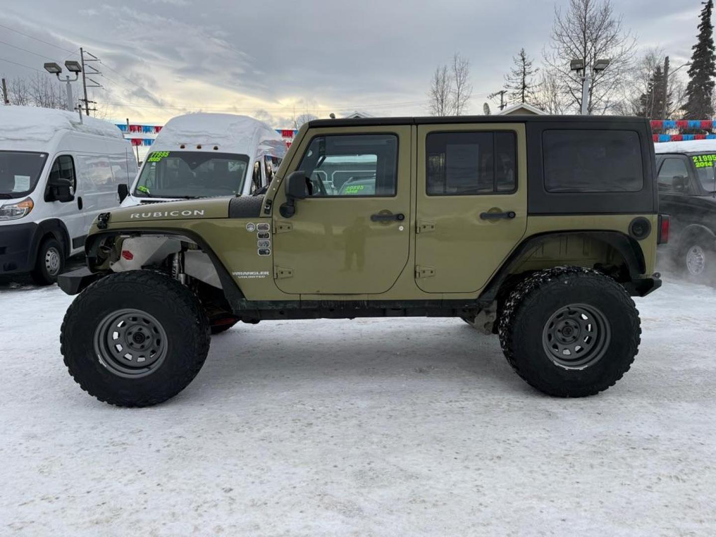 2013 GREEN JEEP WRANGLER UNLIMI RUBICON (1C4BJWFG3DL) with an 3.6L engine, Automatic transmission, located at 929 East 8th Ave, Anchorage, AK, 99501, (907) 274-2277, 61.214783, -149.866074 - Photo#1