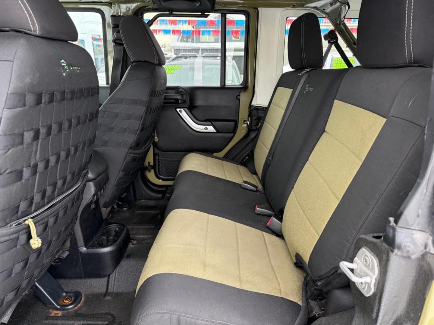 2013 GREEN JEEP WRANGLER UNLIMI RUBICON (1C4BJWFG3DL) with an 3.6L engine, Automatic transmission, located at 929 East 8th Ave, Anchorage, AK, 99501, (907) 274-2277, 61.214783, -149.866074 - Photo#3