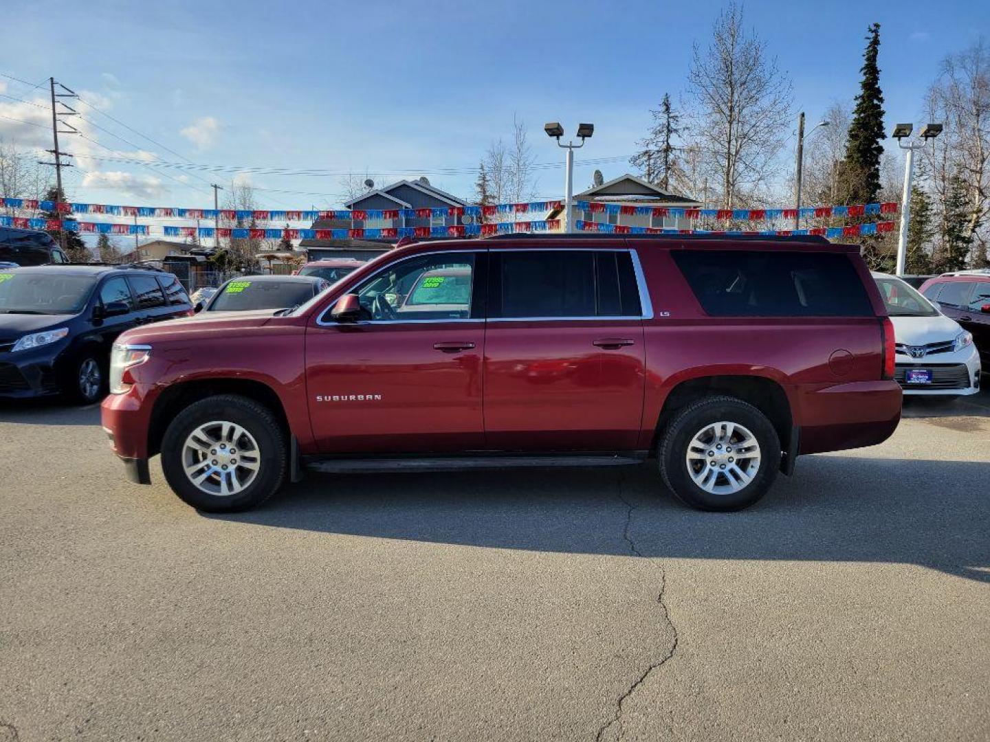 2016 MAROON CHEVROLET SUBURBAN 1500 LS (1GNSKGKC6GR) with an 5.3L engine, Automatic transmission, located at 929 East 8th Ave, Anchorage, AK, 99501, (907) 274-2277, 61.214783, -149.866074 - Photo#1