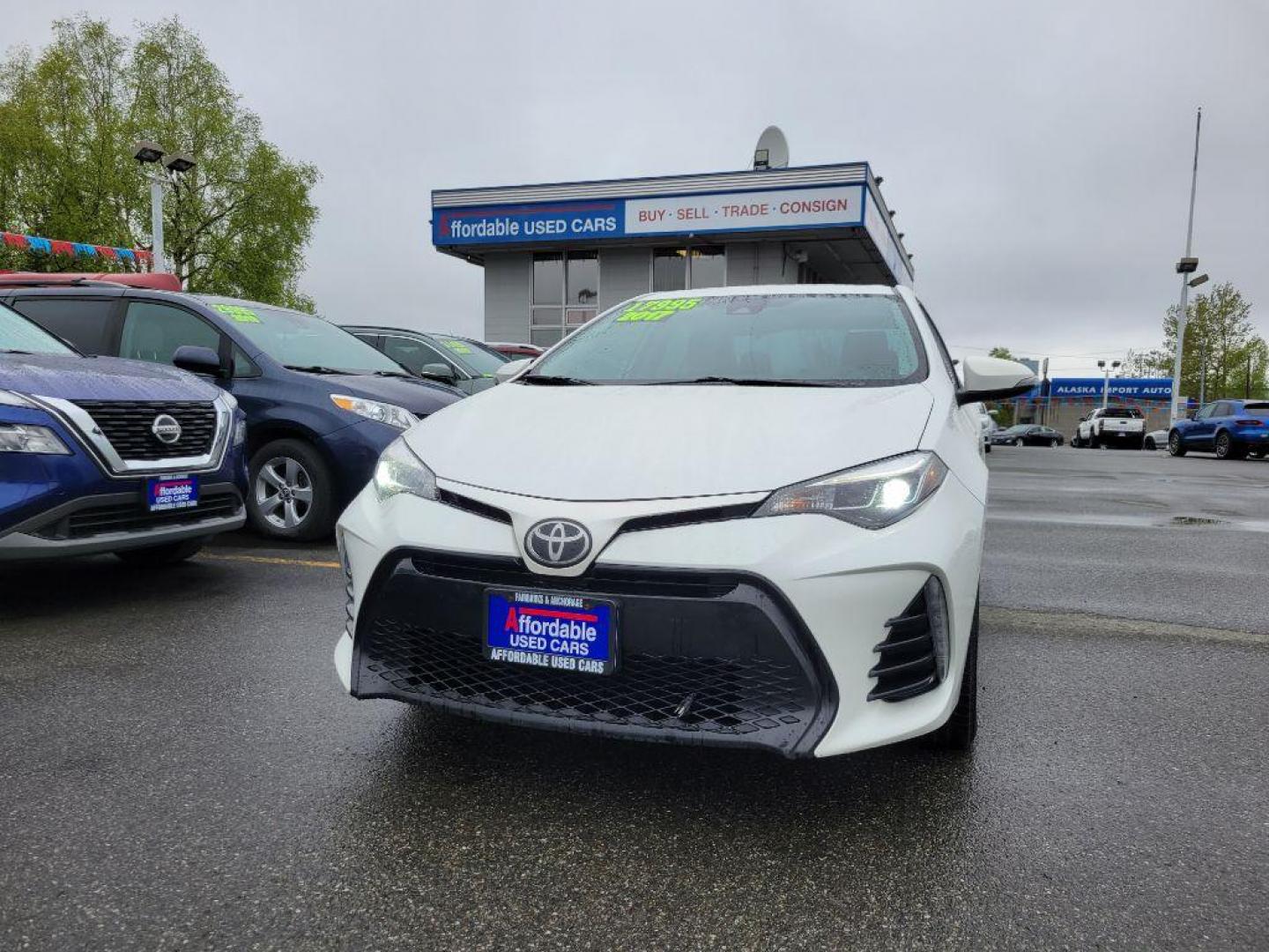 2017 WHITE TOYOTA COROLLA L (5YFBURHE8HP) with an 1.8L engine, Continuously Variable transmission, located at 929 East 8th Ave, Anchorage, AK, 99501, (907) 274-2277, 61.214783, -149.866074 - Photo#0