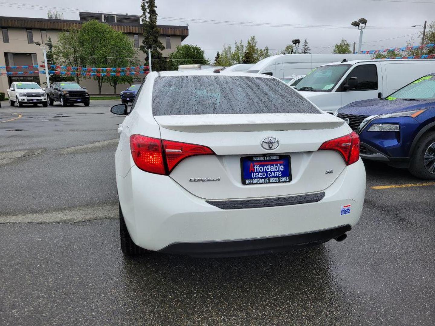 2017 WHITE TOYOTA COROLLA L (5YFBURHE8HP) with an 1.8L engine, Continuously Variable transmission, located at 929 East 8th Ave, Anchorage, AK, 99501, (907) 274-2277, 61.214783, -149.866074 - Photo#2