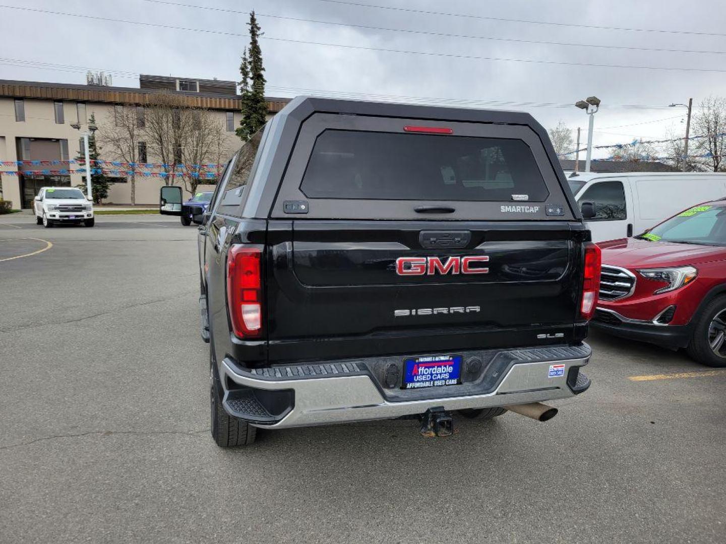 2021 BLACK GMC SIERRA 2500 SLE (1GT49ME71MF) with an 6.6L engine, Automatic transmission, located at 929 East 8th Ave, Anchorage, AK, 99501, (907) 274-2277, 61.214783, -149.866074 - Photo#2