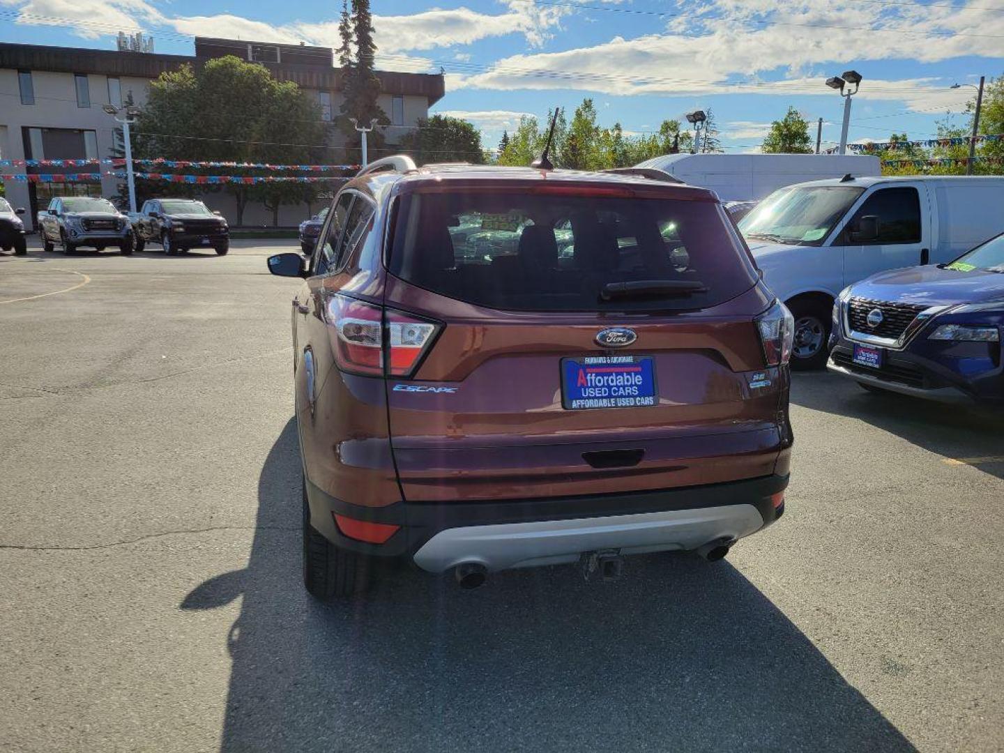 2018 MAROON FORD ESCAPE SE (1FMCU9GD5JU) with an 1.5L engine, Automatic transmission, located at 929 East 8th Ave, Anchorage, AK, 99501, (907) 274-2277, 61.214783, -149.866074 - Photo#2