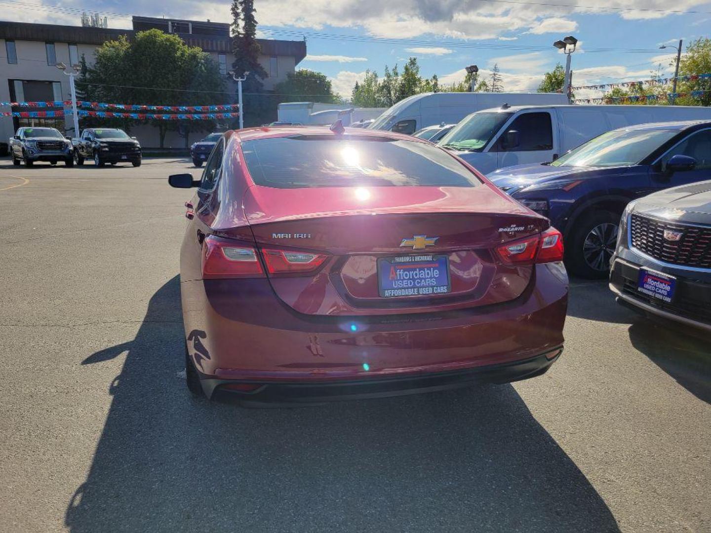 2018 MAROON CHEVROLET MALIBU LT (1G1ZD5ST4JF) with an 1.5L engine, Automatic transmission, located at 929 East 8th Ave, Anchorage, AK, 99501, (907) 274-2277, 61.214783, -149.866074 - Photo#2