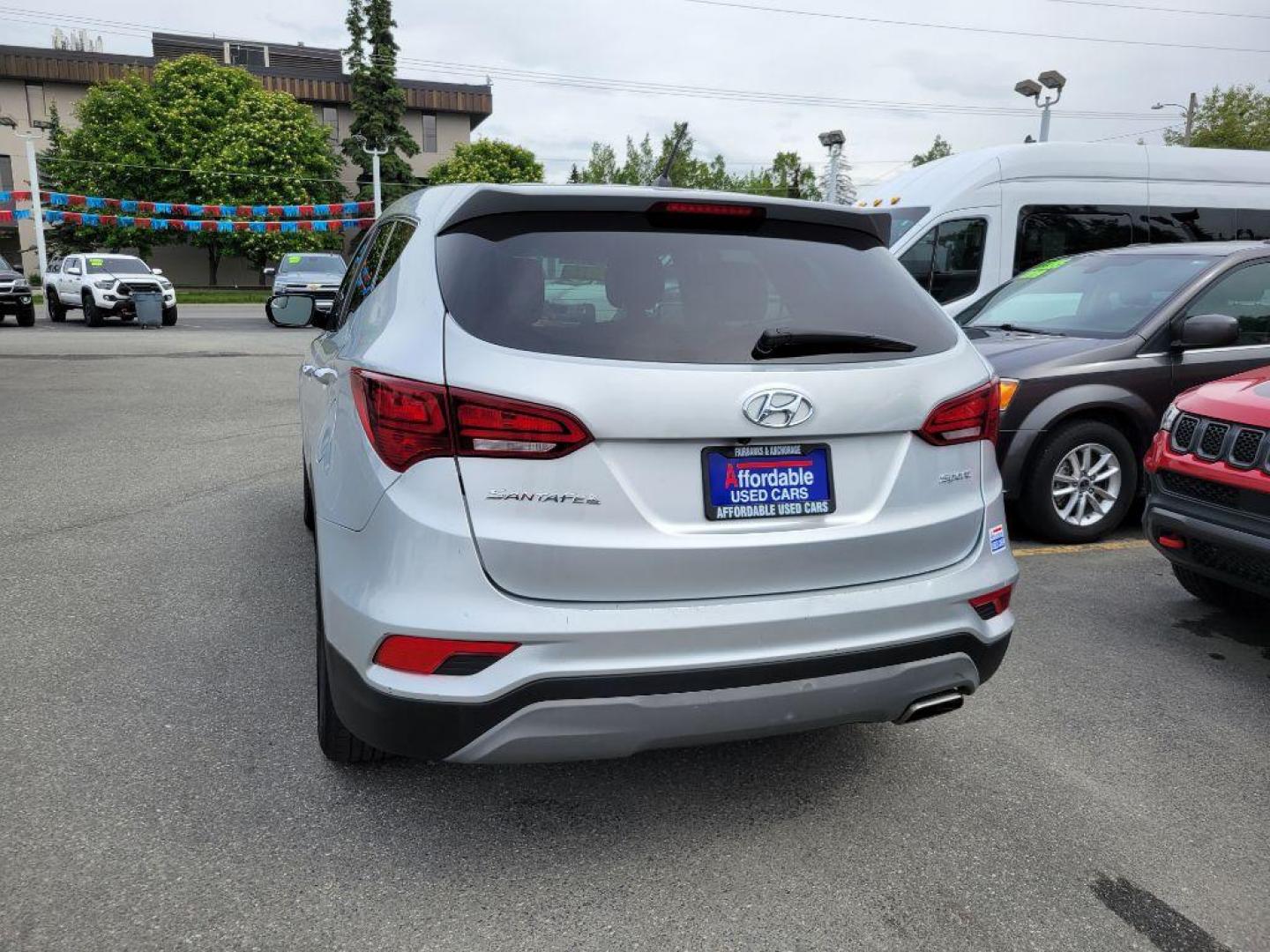 2018 SILVER HYUNDAI SANTA FE SPORT (5XYZT3LB2JG) with an 2.4L engine, Automatic transmission, located at 929 East 8th Ave, Anchorage, AK, 99501, (907) 274-2277, 61.214783, -149.866074 - Photo#2