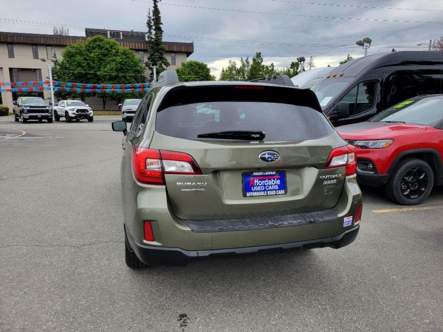 2015 GREEN SUBARU OUTBACK 2.5I PREMIUM (4S4BSADC2F3) with an 2.5L engine, Continuously Variable transmission, located at 929 East 8th Ave, Anchorage, AK, 99501, (907) 274-2277, 61.214783, -149.866074 - Photo#2