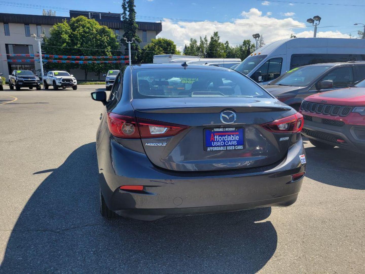 2016 GRAY MAZDA 3 TOURING (JM1BM1W76G1) with an 2.0L engine, 6-Speed Manual transmission, located at 929 East 8th Ave, Anchorage, AK, 99501, (907) 274-2277, 61.214783, -149.866074 - Photo#2