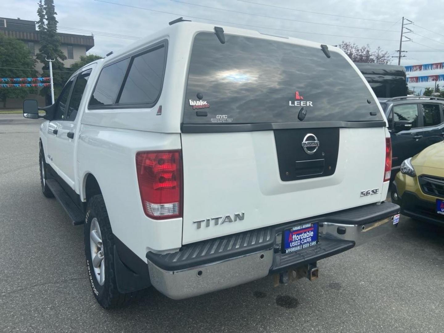 2010 WHITE NISSAN TITAN XE (1N6AA0EC4AN) with an 5.6L engine, Automatic transmission, located at 929 East 8th Ave, Anchorage, AK, 99501, (907) 274-2277, 61.214783, -149.866074 - Photo#2