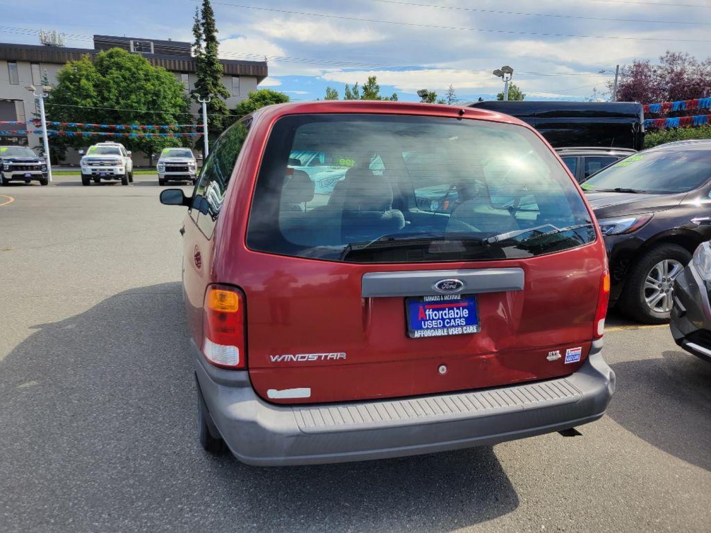 1999 MAROON FORD WINDSTAR LX (2FMZA5149XB) with an 3.8L engine, Automatic transmission, located at 929 East 8th Ave, Anchorage, AK, 99501, (907) 274-2277, 61.214783, -149.866074 - Photo#2