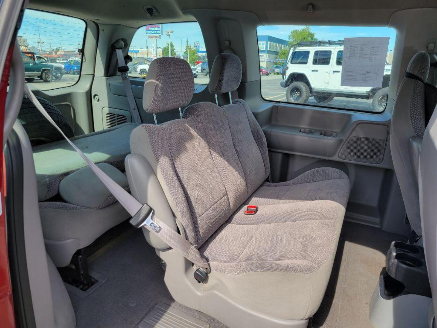 1999 MAROON FORD WINDSTAR LX (2FMZA5149XB) with an 3.8L engine, Automatic transmission, located at 929 East 8th Ave, Anchorage, AK, 99501, (907) 274-2277, 61.214783, -149.866074 - Photo#3