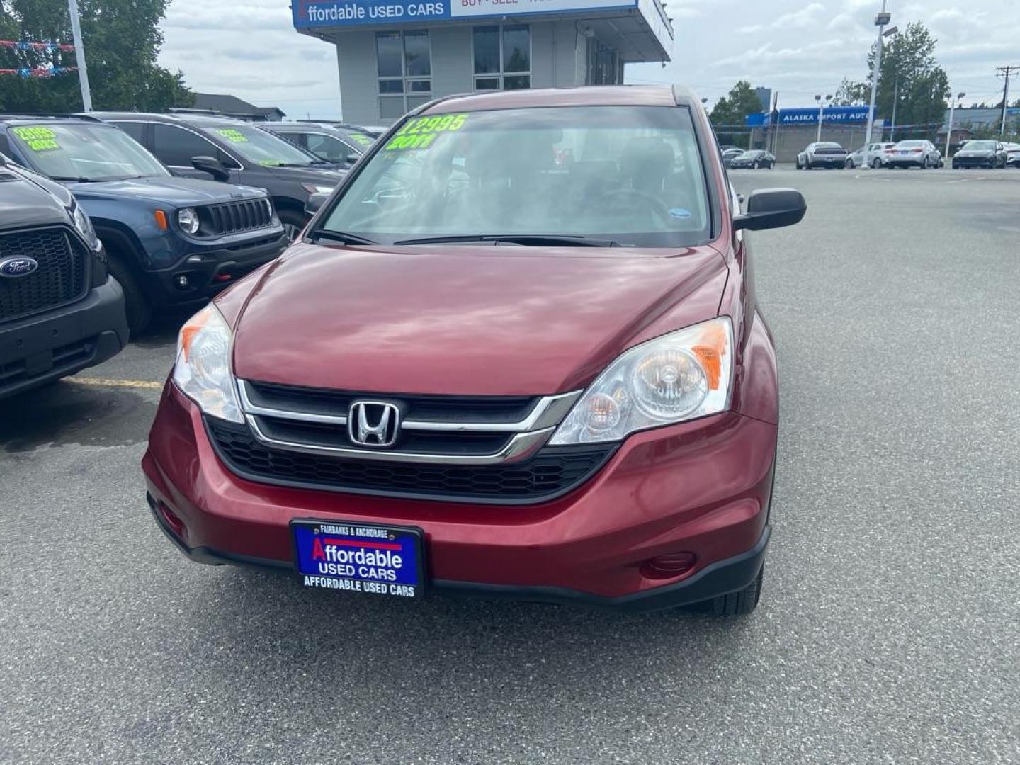 2011 RED HONDA CR-V LX (JHLRE4H32BC) with an 2.4L engine, Automatic transmission, located at 929 East 8th Ave, Anchorage, AK, 99501, (907) 274-2277, 61.214783, -149.866074 - Photo#0