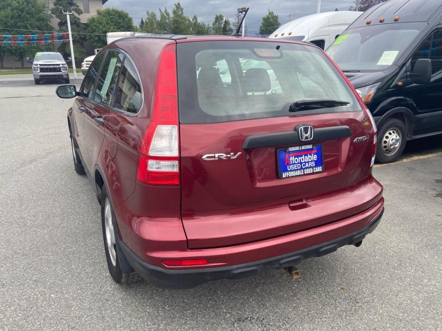 2011 RED HONDA CR-V LX (JHLRE4H32BC) with an 2.4L engine, Automatic transmission, located at 929 East 8th Ave, Anchorage, AK, 99501, (907) 274-2277, 61.214783, -149.866074 - Photo#2