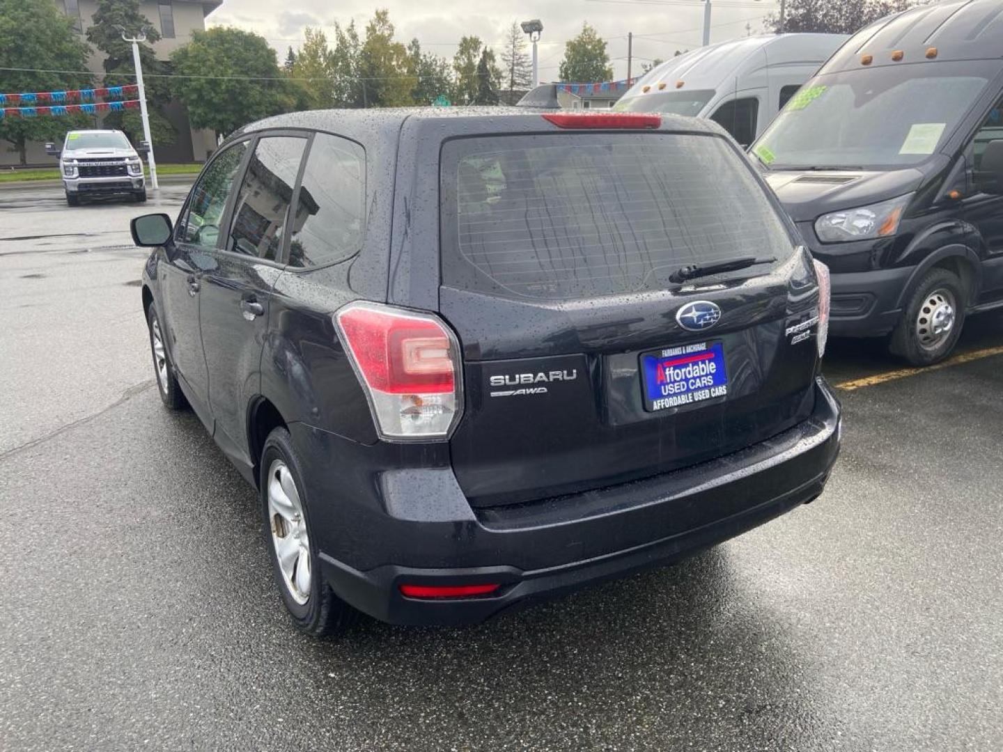 2017 BLACK SUBARU FORESTER 2.5I (JF2SJAAC5HG) with an 2.5L engine, 6-Speed Manual transmission, located at 929 East 8th Ave, Anchorage, AK, 99501, (907) 274-2277, 61.214783, -149.866074 - Photo#2