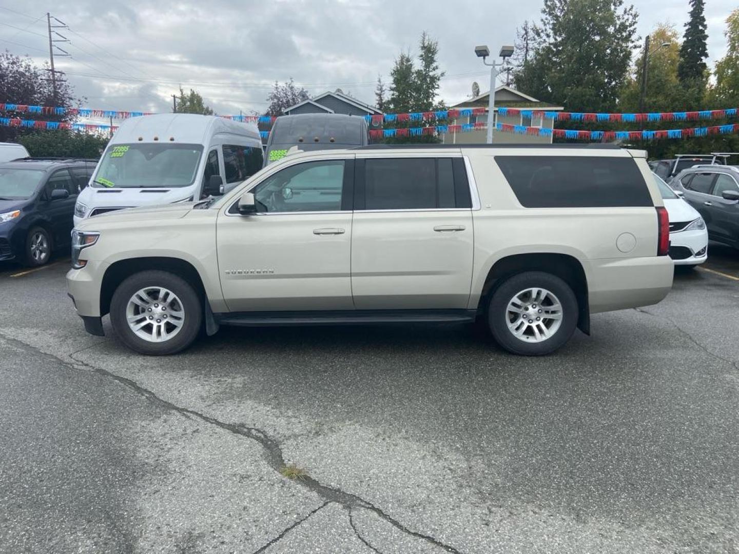 2017 GOLD CHEVROLET SUBURBAN 1500 LT (1GNSKHKC9HR) with an 5.3L engine, Automatic transmission, located at 929 East 8th Ave, Anchorage, AK, 99501, (907) 274-2277, 61.214783, -149.866074 - Photo#1