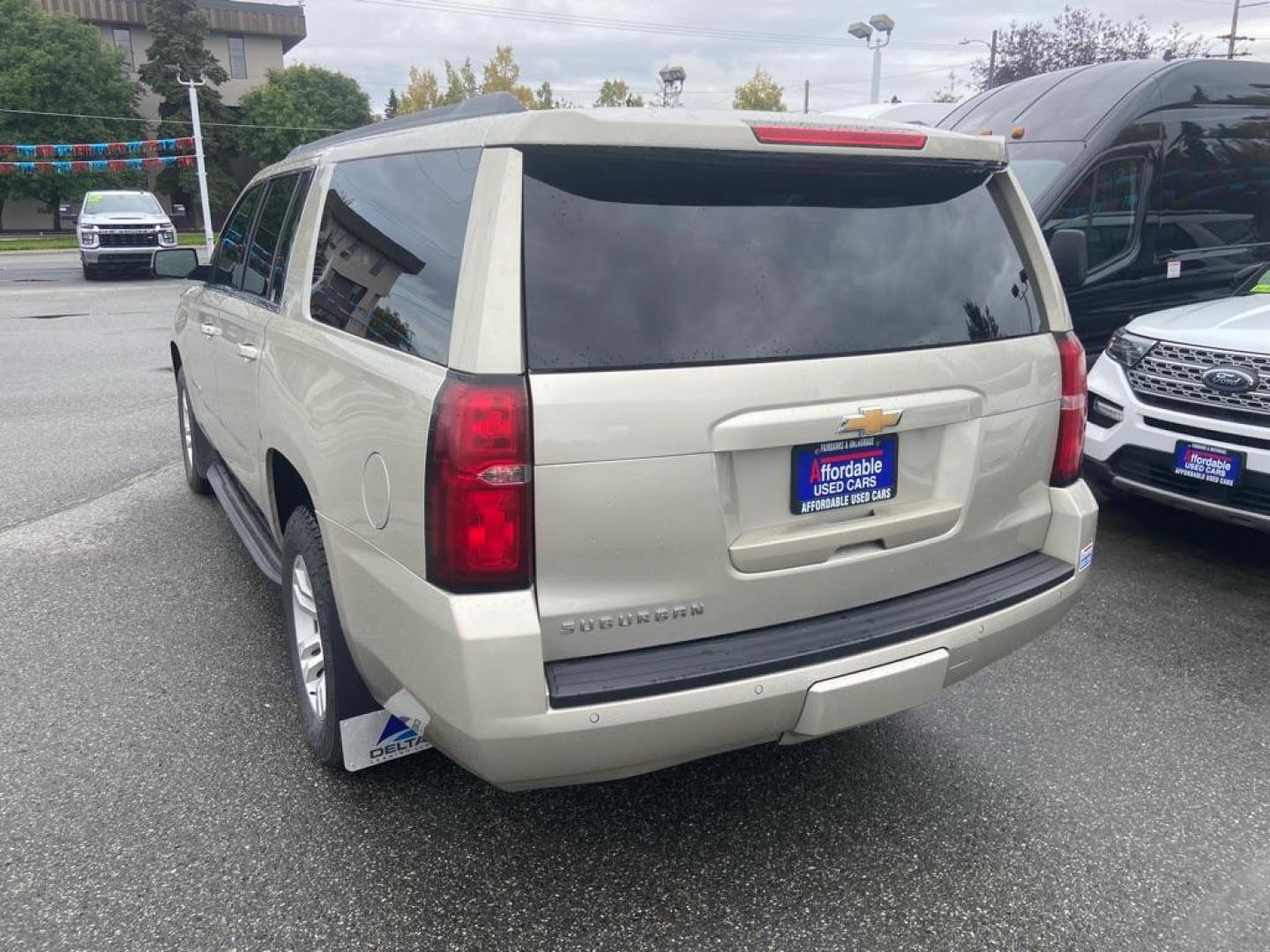 2017 GOLD CHEVROLET SUBURBAN 1500 LT (1GNSKHKC9HR) with an 5.3L engine, Automatic transmission, located at 929 East 8th Ave, Anchorage, AK, 99501, (907) 274-2277, 61.214783, -149.866074 - Photo#2