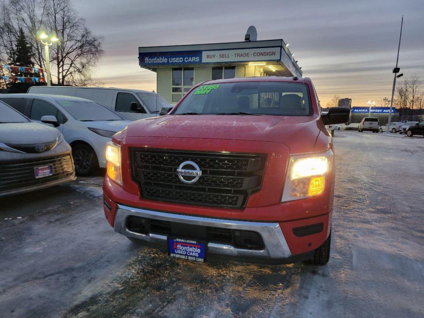 2021 RED NISSAN TITAN SV (1N6AA1ED2MN) with an 5.6L engine, Automatic transmission, located at 929 East 8th Ave, Anchorage, AK, 99501, (907) 274-2277, 61.214783, -149.866074 - Photo#0