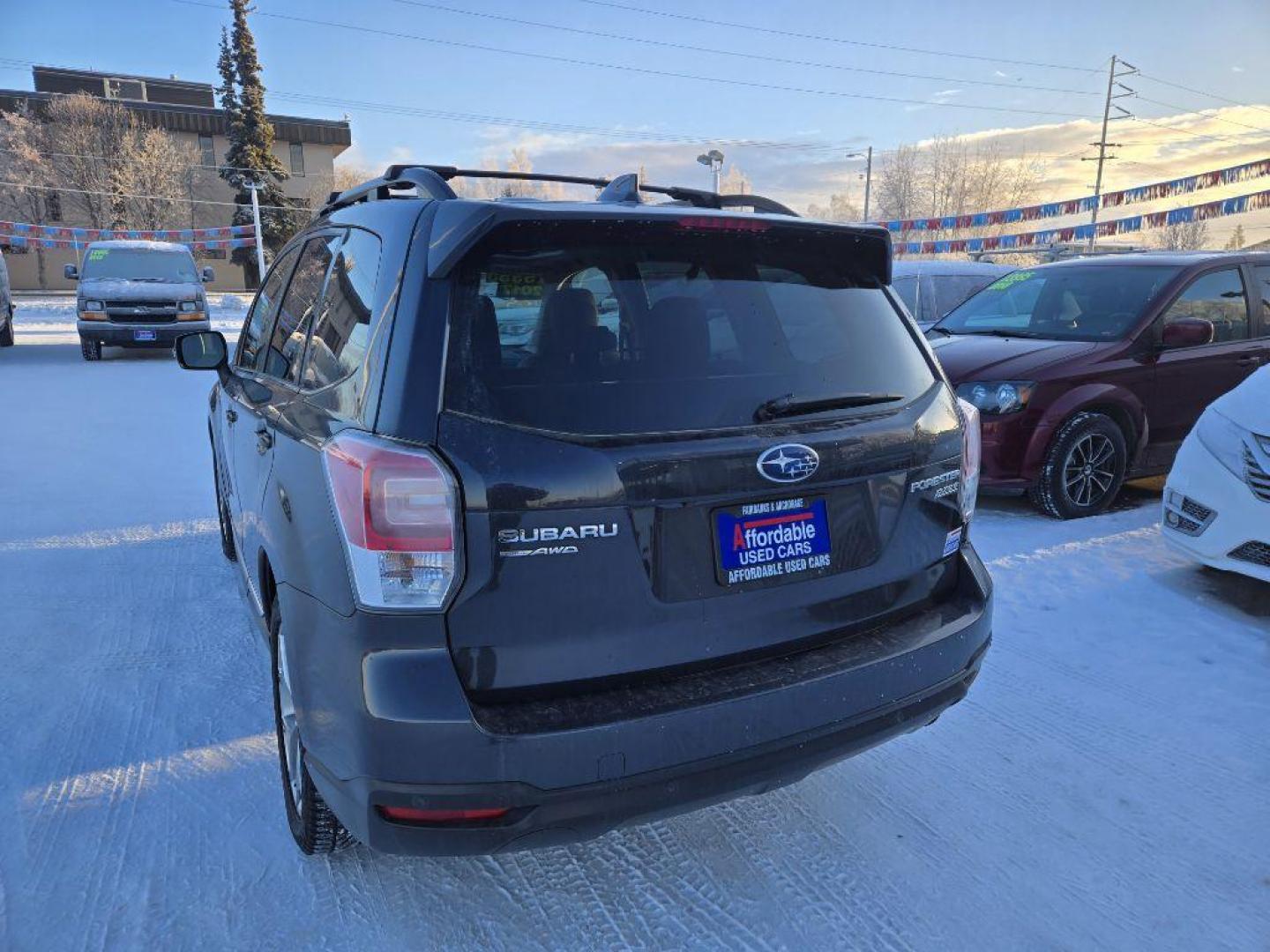 2017 BLACK SUBARU FORESTER 2.5I TOURING (JF2SJAWC6HH) with an 2.5L engine, Continuously Variable transmission, located at 929 East 8th Ave, Anchorage, AK, 99501, (907) 274-2277, 61.214783, -149.866074 - Photo#2