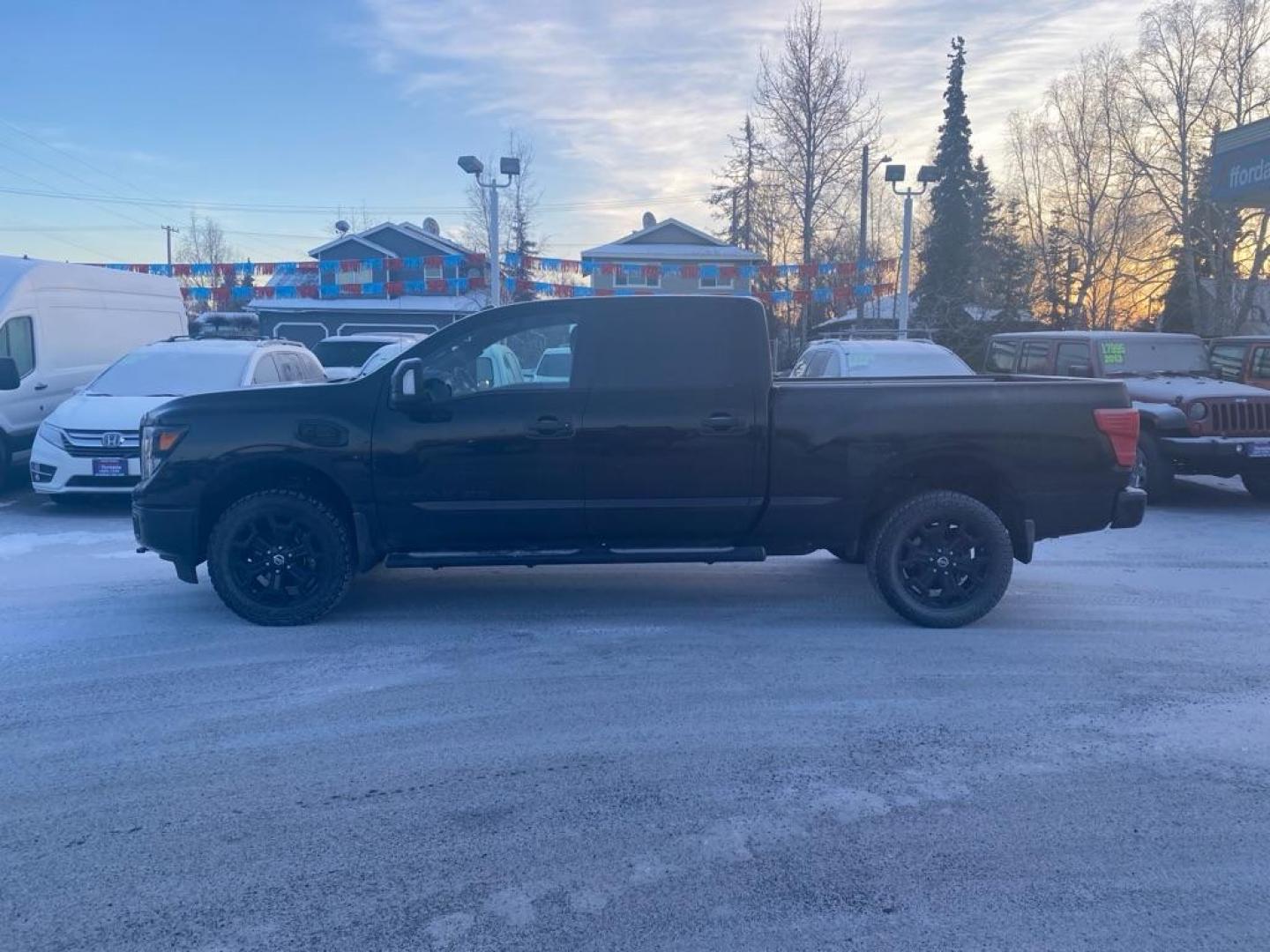 2018 BLACK NISSAN TITAN XD SL (1N6BA1F41JN) with an 5.0L engine, Automatic transmission, located at 929 East 8th Ave, Anchorage, AK, 99501, (907) 274-2277, 61.214783, -149.866074 - Photo#1