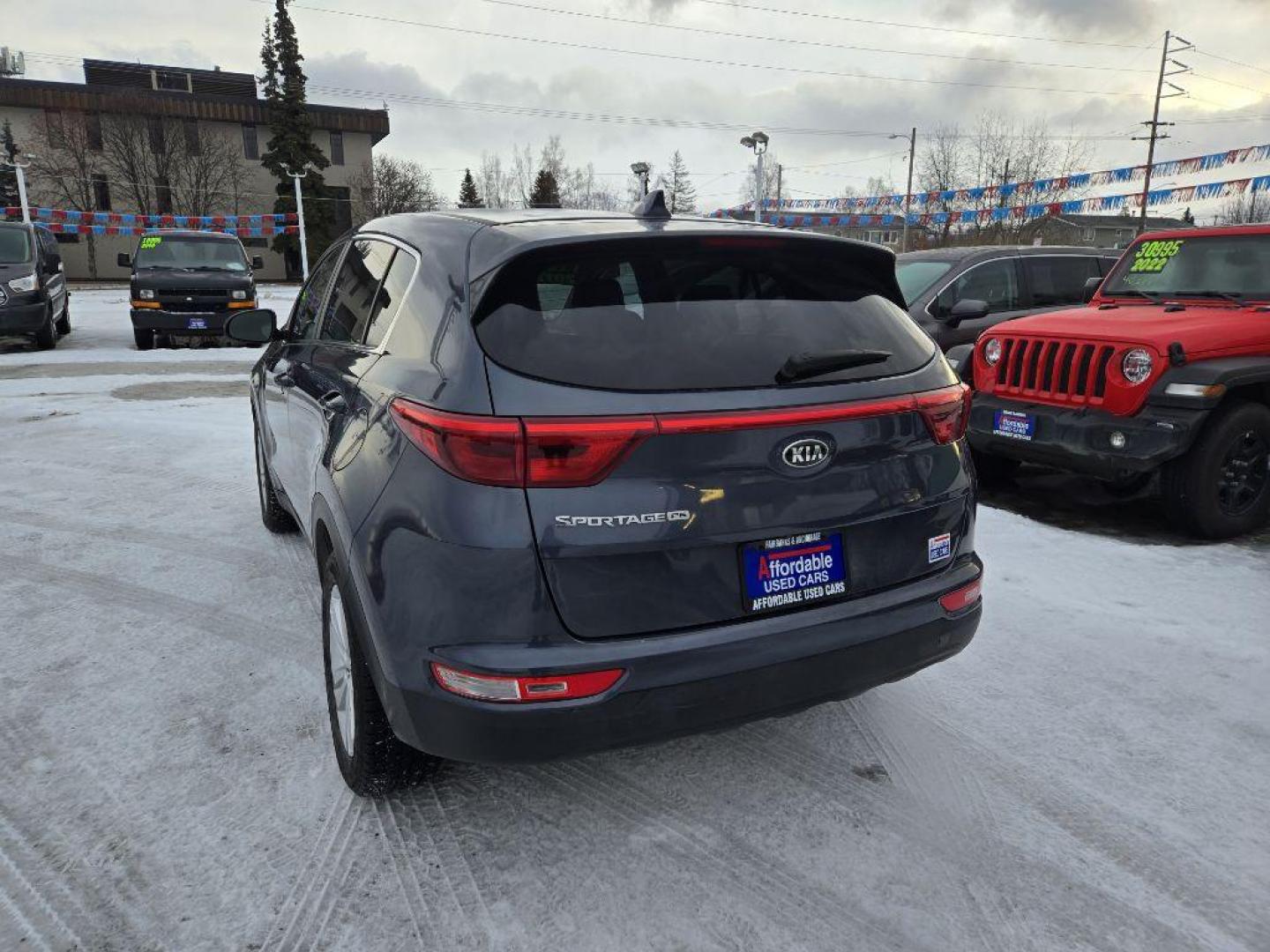 2017 BLUE KIA SPORTAGE LX (KNDPM3AC7H7) with an 2.4L engine, Automatic transmission, located at 929 East 8th Ave, Anchorage, AK, 99501, (907) 274-2277, 61.214783, -149.866074 - Photo#2