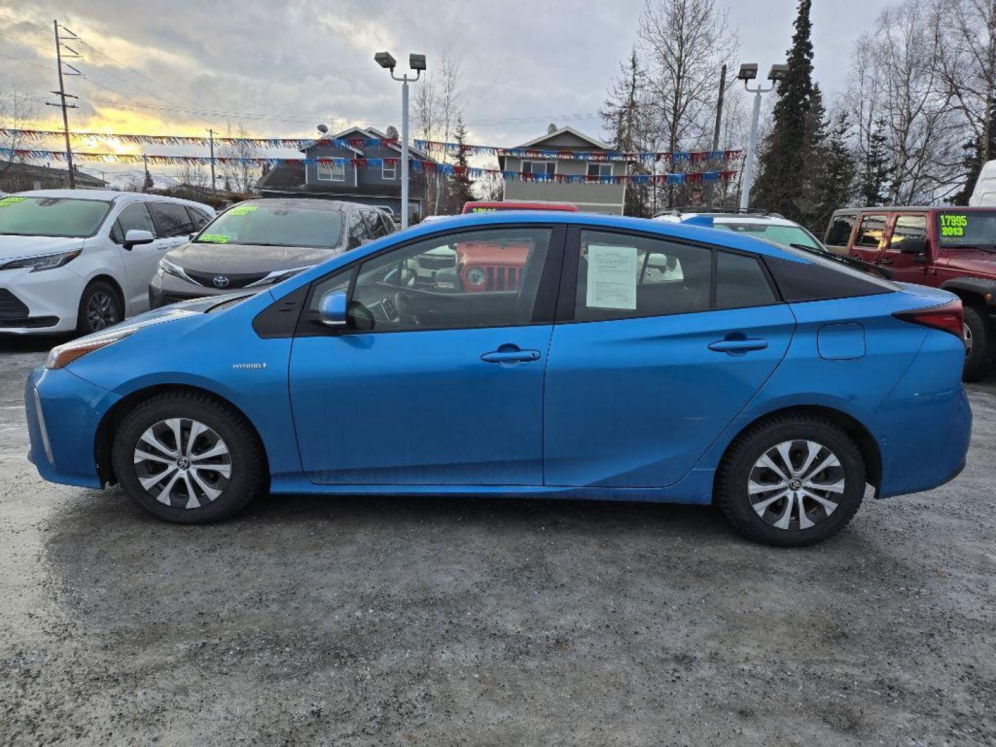 2021 BLUE TOYOTA PRIUS LE (JTDL9MFU9M3) with an 1.8L engine, Continuously Variable transmission, located at 929 East 8th Ave, Anchorage, AK, 99501, (907) 274-2277, 61.214783, -149.866074 - Photo#2