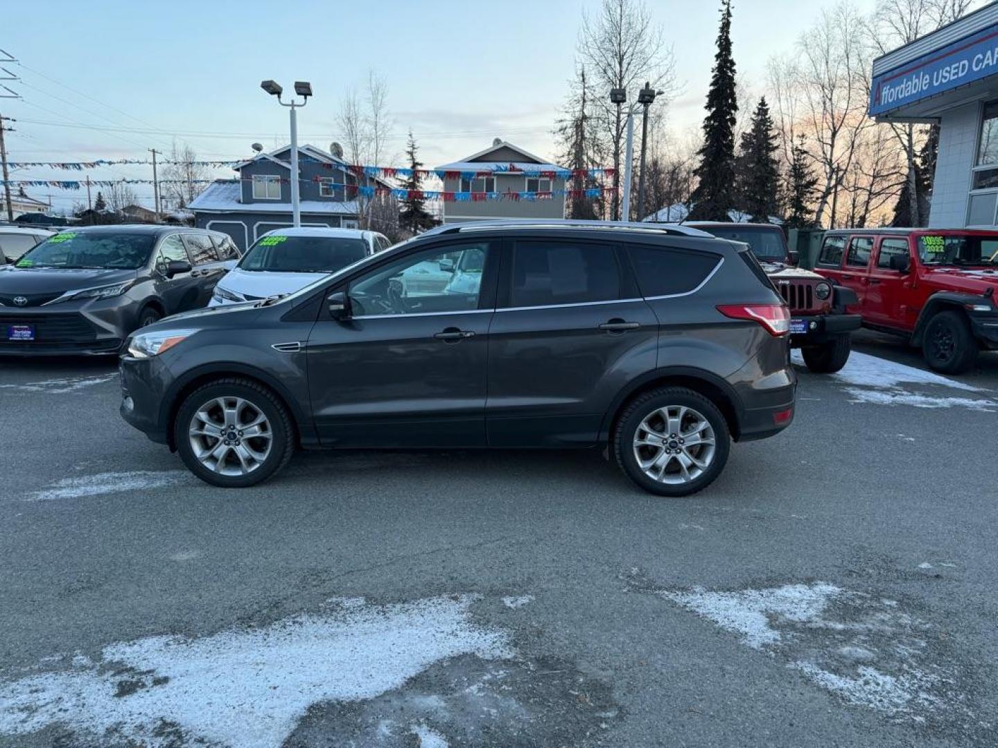 2015 GRAY FORD ESCAPE TITANIUM (1FMCU9J9XFU) with an 2.0L engine, Automatic transmission, located at 929 East 8th Ave, Anchorage, AK, 99501, (907) 274-2277, 61.214783, -149.866074 - Photo#1