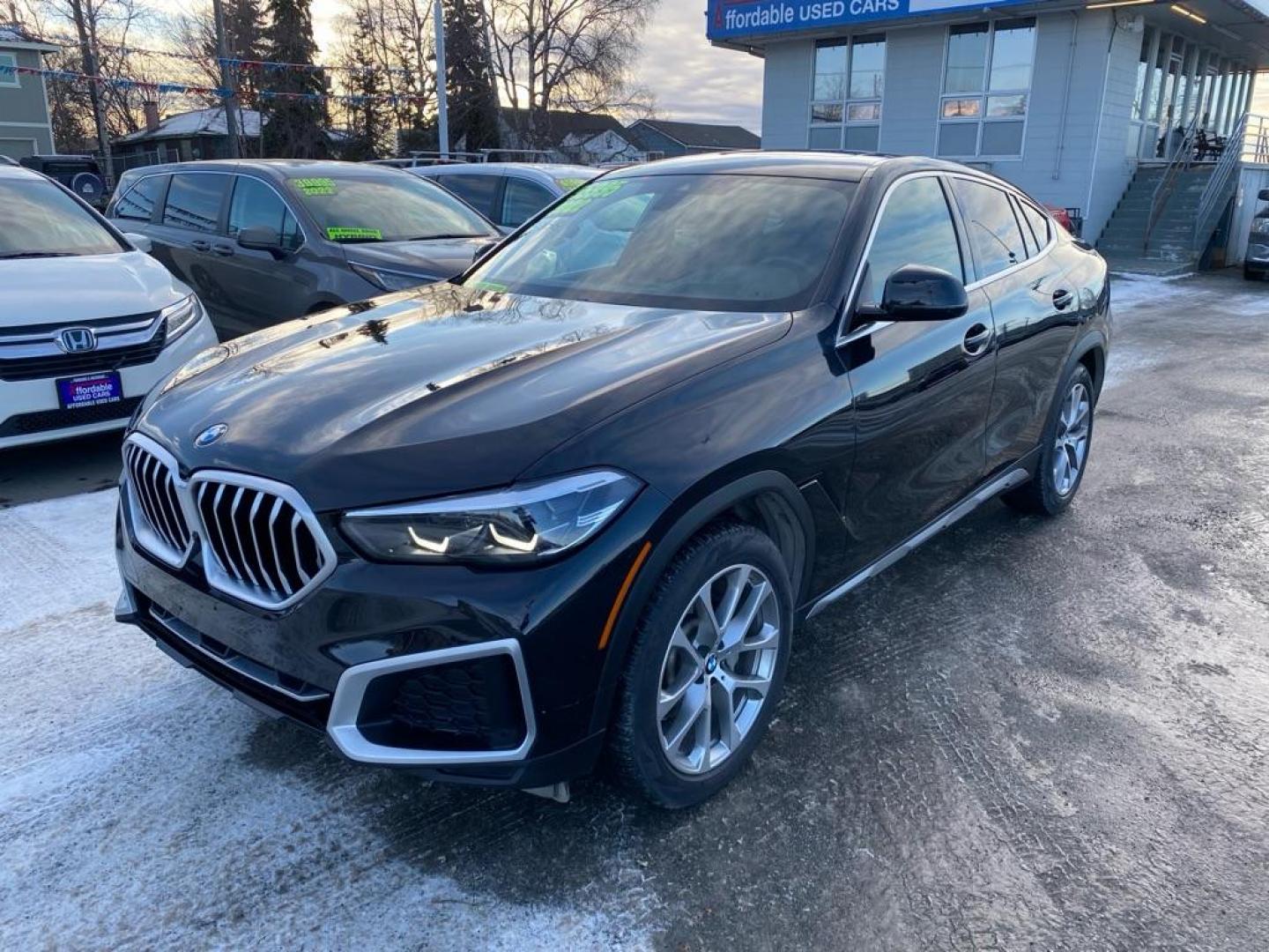 2022 BLACK BMW X6 XDRIVE40I (5UXCY6C03N9) with an 3.0L engine, Automatic transmission, located at 929 East 8th Ave, Anchorage, AK, 99501, (907) 274-2277, 61.214783, -149.866074 - Photo#0