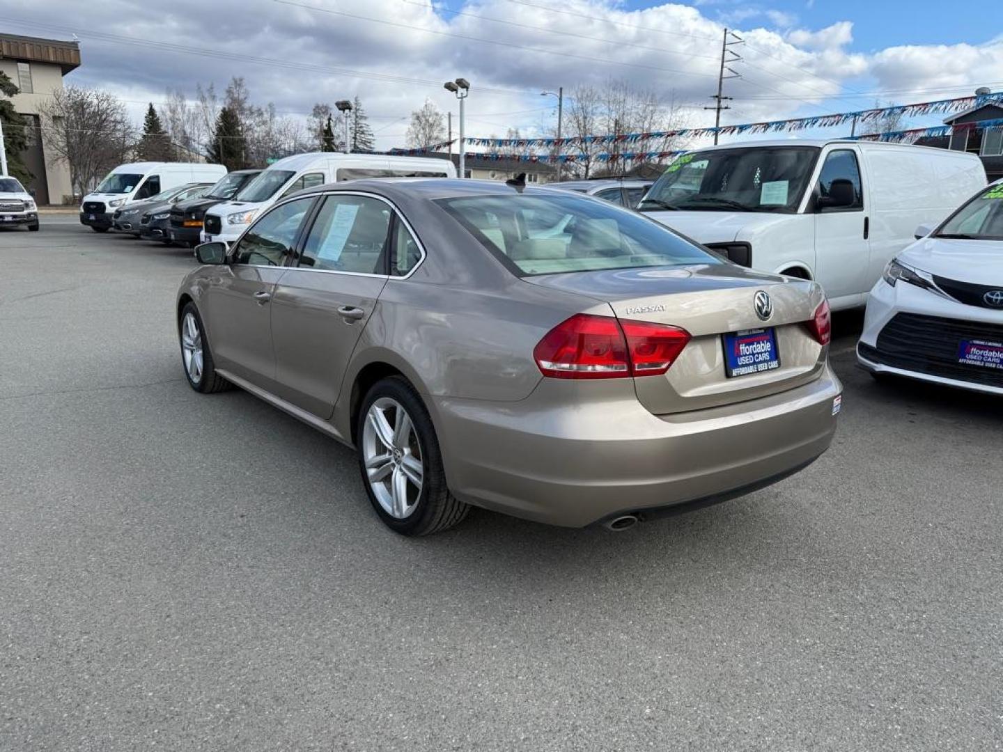 2015 GOLD VOLKSWAGEN PASSAT SE (1VWBV7A30FC) with an 2L engine, 6-Speed Manual transmission, located at 929 East 8th Ave, Anchorage, AK, 99501, (907) 274-2277, 61.214783, -149.866074 - Photo#2