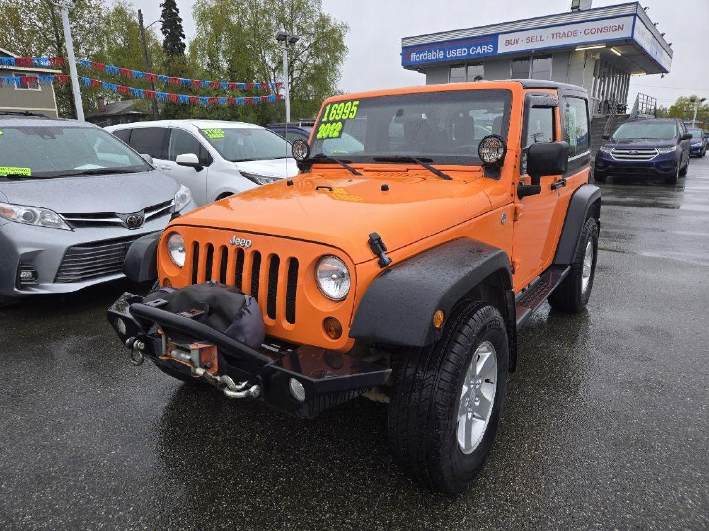 2012 ORANGE JEEP WRANGLER SPORT (1C4AJWAG9CL) with an 3.6L engine, Automatic transmission, located at 929 East 8th Ave, Anchorage, AK, 99501, (907) 274-2277, 61.214783, -149.866074 - Photo#0
