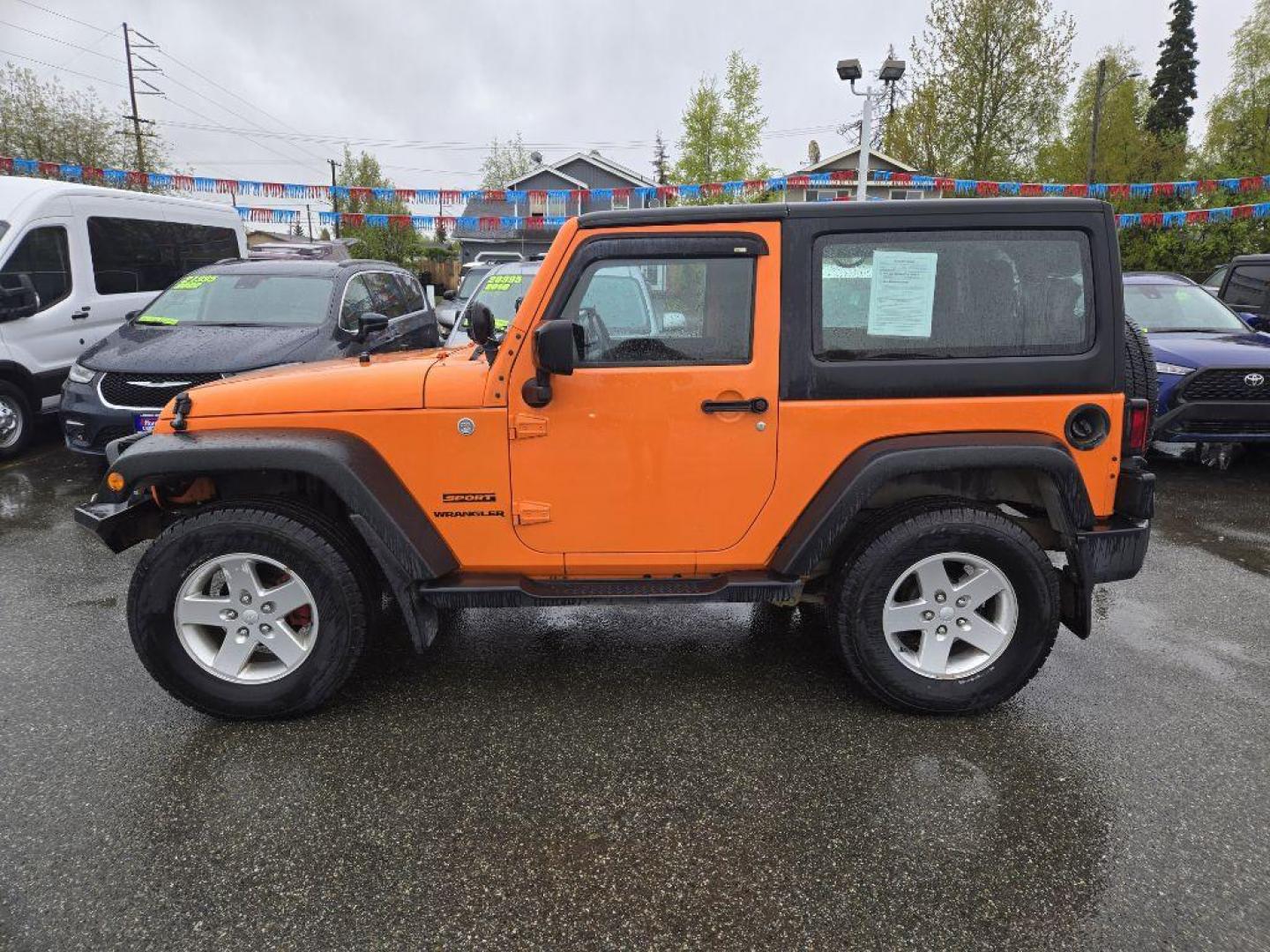 2012 ORANGE JEEP WRANGLER SPORT (1C4AJWAG9CL) with an 3.6L engine, Automatic transmission, located at 929 East 8th Ave, Anchorage, AK, 99501, (907) 274-2277, 61.214783, -149.866074 - Photo#1