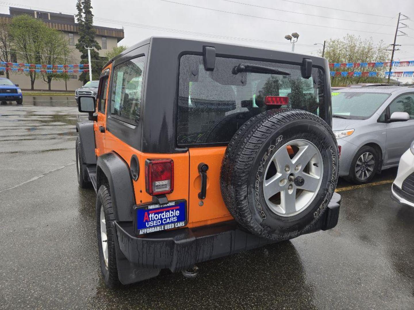2012 ORANGE JEEP WRANGLER SPORT (1C4AJWAG9CL) with an 3.6L engine, Automatic transmission, located at 929 East 8th Ave, Anchorage, AK, 99501, (907) 274-2277, 61.214783, -149.866074 - Photo#2