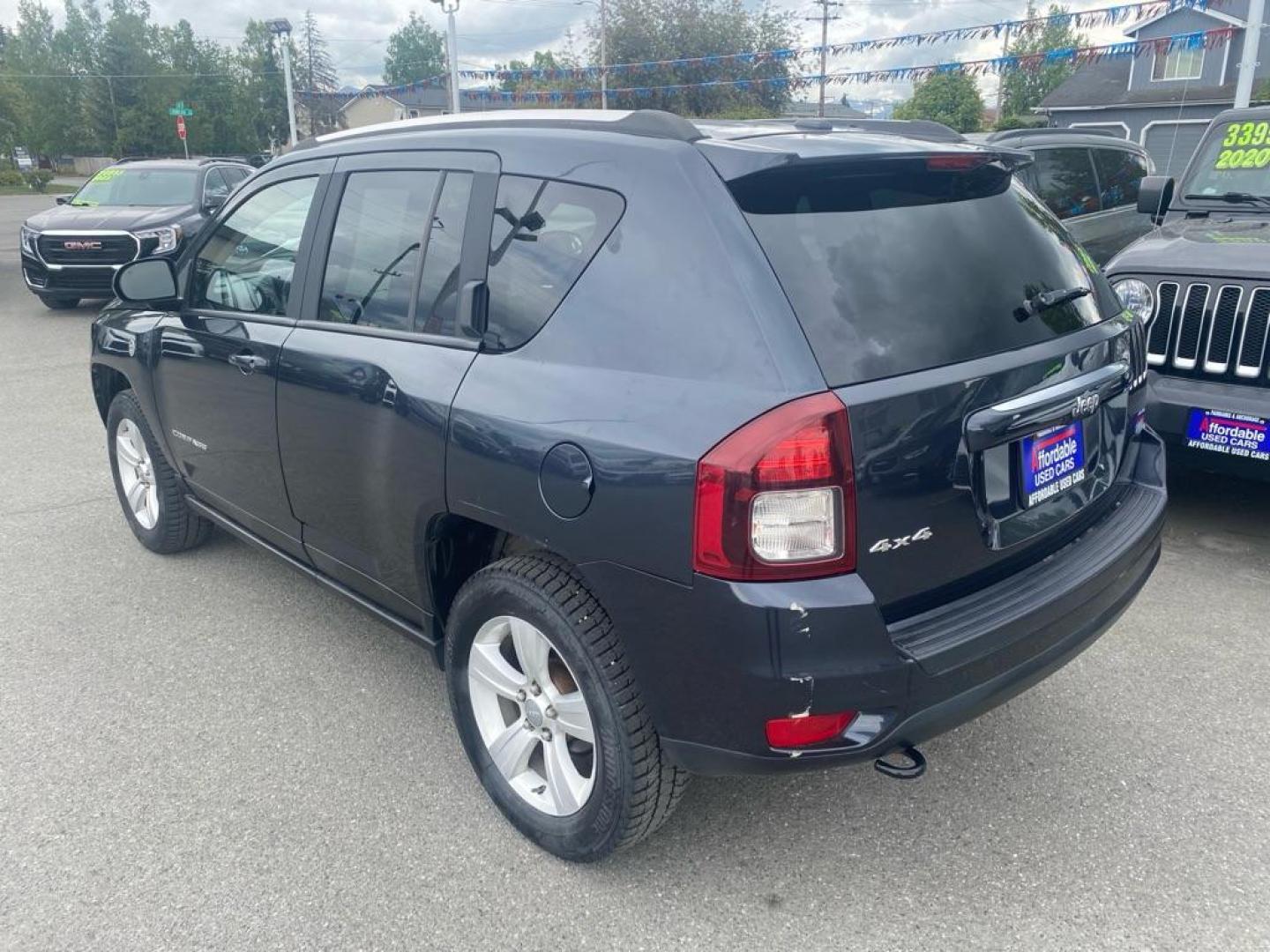 2014 BLACK JEEP COMPASS LATITUDE (1C4NJDEB6ED) with an 2.4L engine, Continuously Variable transmission, located at 929 East 8th Ave, Anchorage, AK, 99501, (907) 274-2277, 61.214783, -149.866074 - Photo#2