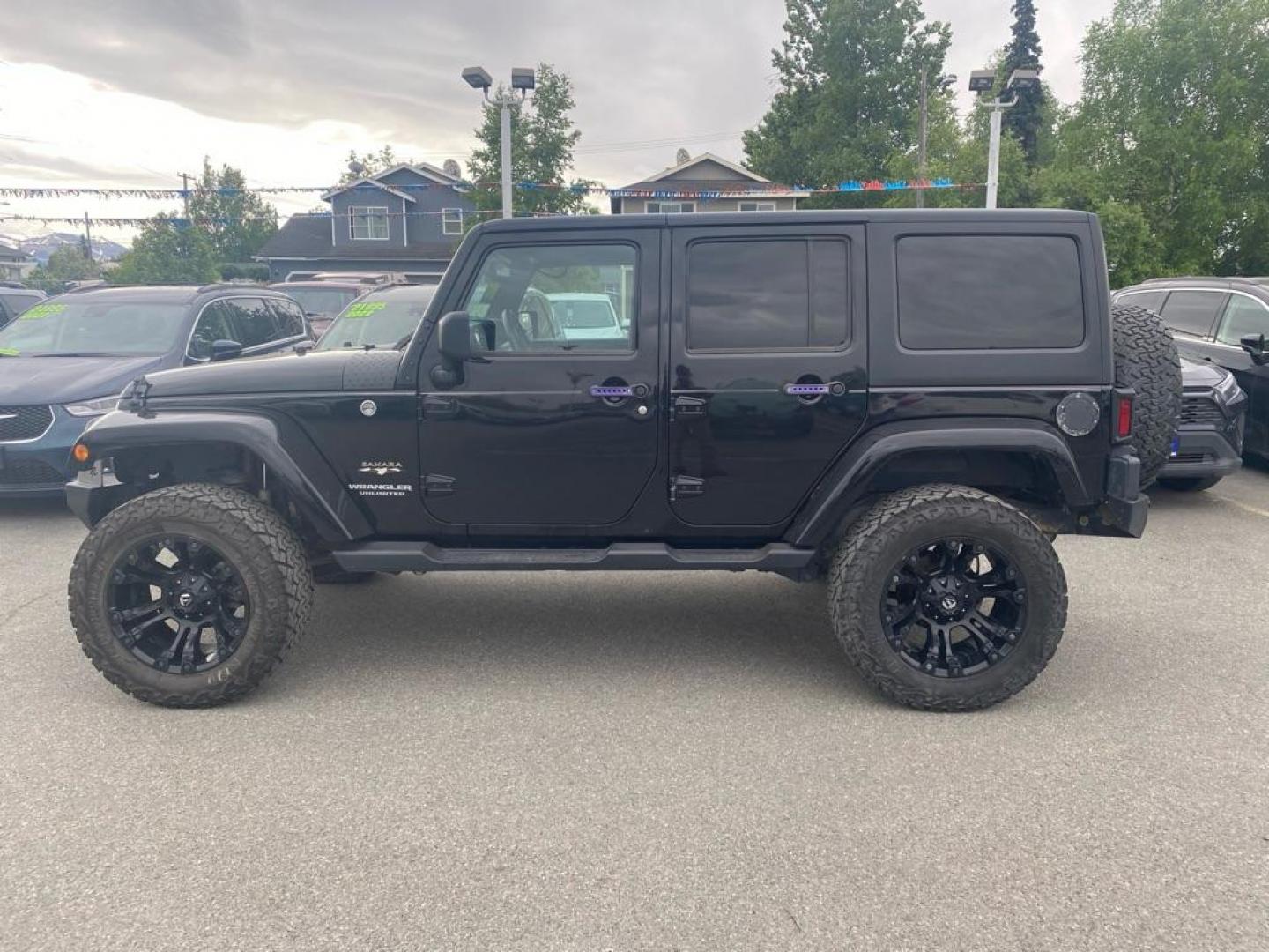 2017 BLACK JEEP WRANGLER UNLIMI SAHARA (1C4HJWEG4HL) with an 3.6L engine, Automatic transmission, located at 929 East 8th Ave, Anchorage, AK, 99501, (907) 274-2277, 61.214783, -149.866074 - Photo#1
