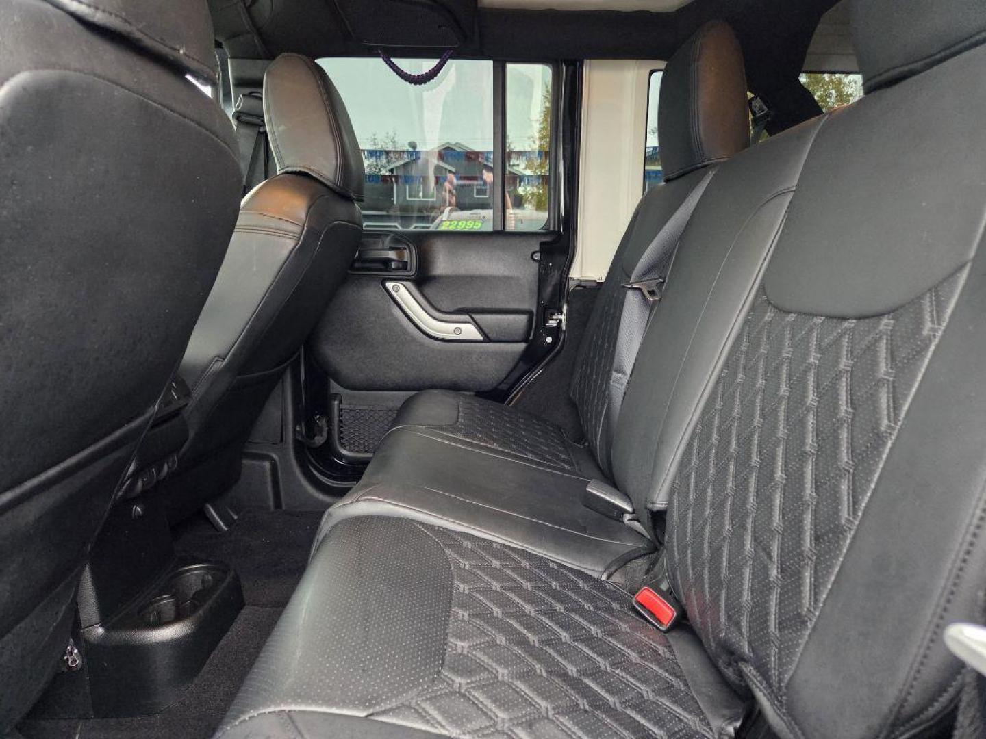 2017 BLACK JEEP WRANGLER UNLIMI SAHARA (1C4HJWEG4HL) with an 3.6L engine, Automatic transmission, located at 929 East 8th Ave, Anchorage, AK, 99501, (907) 274-2277, 61.214783, -149.866074 - Photo#4
