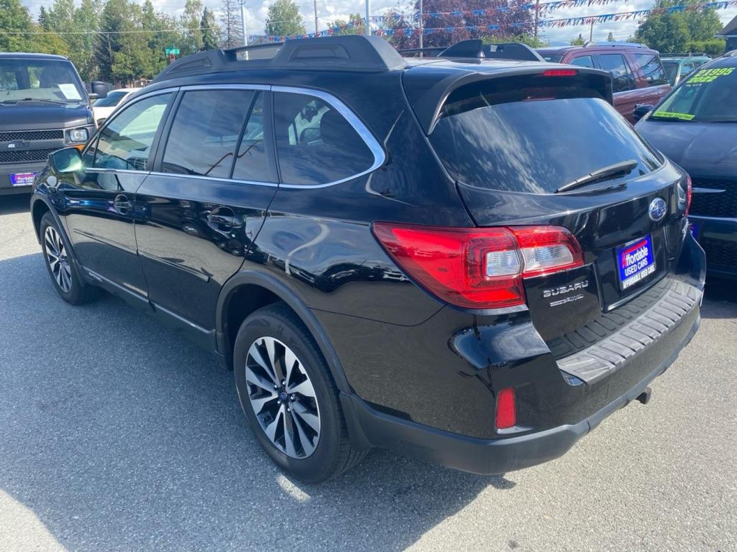 2016 BLACK SUBARU OUTBACK 2.5I LIMITED (4S4BSANC8G3) with an 2.5L engine, Continuously Variable transmission, located at 929 East 8th Ave, Anchorage, AK, 99501, (907) 274-2277, 61.214783, -149.866074 - Photo#2