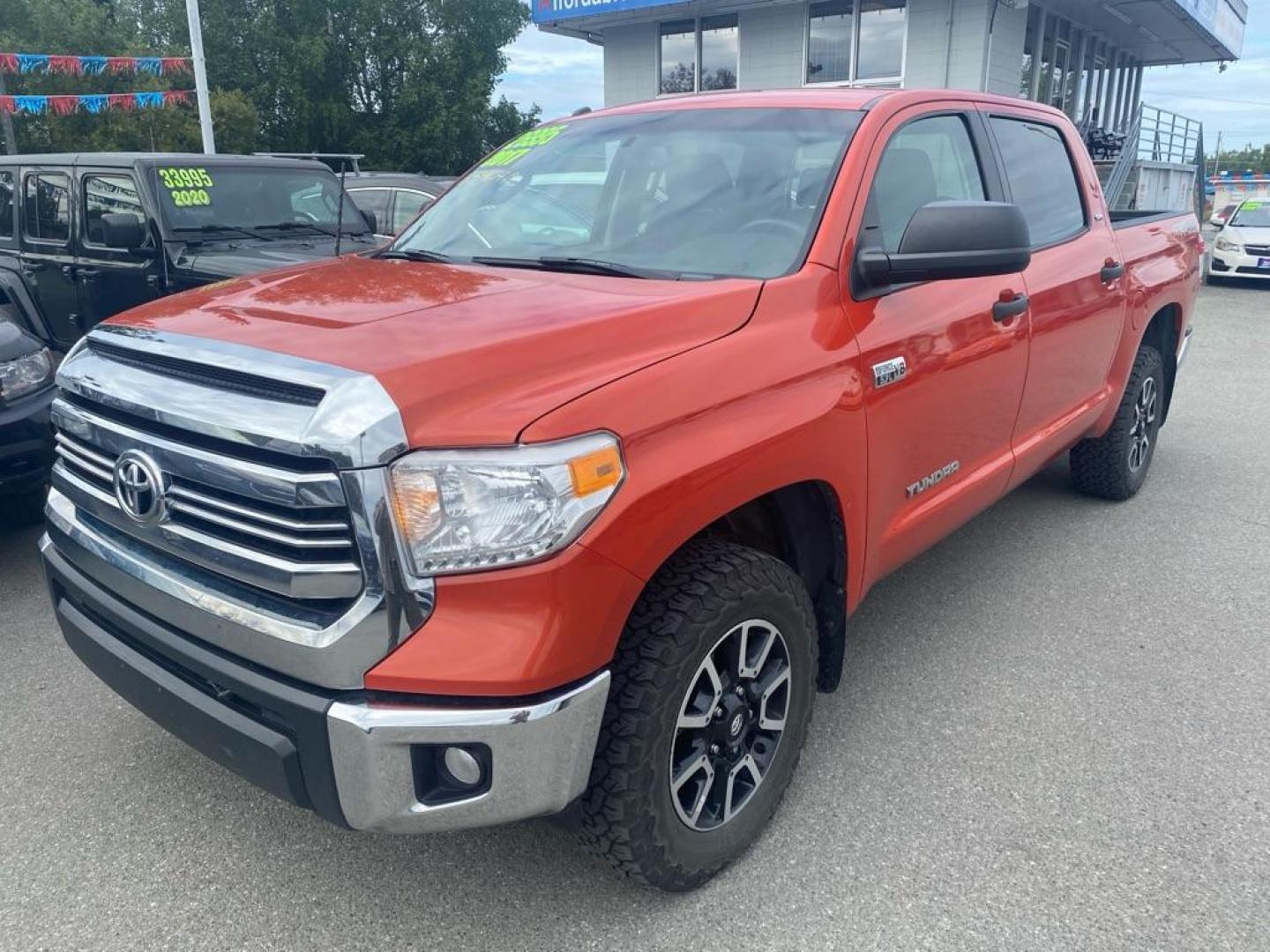 2017 ORANGE TOYOTA TUNDRA CREWMAX SR5 (5TFDY5F19HX) with an 5.7L engine, Automatic transmission, located at 929 East 8th Ave, Anchorage, AK, 99501, (907) 274-2277, 61.214783, -149.866074 - Photo#0